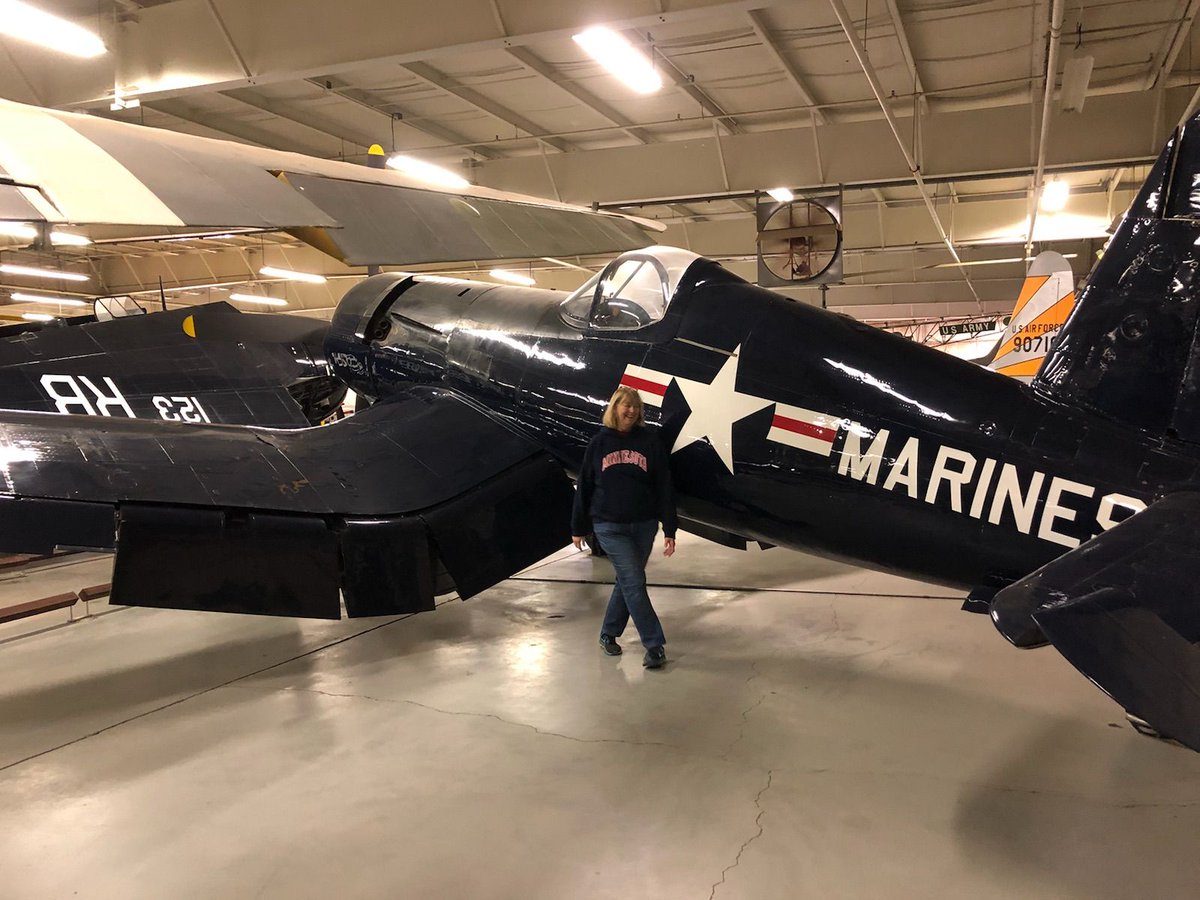 MuseumLiberal's tweet photo. We love hearing visitors' stories! Here a recent visitor, Ruth, is standing next to our #bentWingBird #Corsair (F4U-5N night fighter version) like the one her father flew. It's actually on loan to us from @MarineMuseum and we couldn't be more thankful! https://t.co/AgqQHDQVKu