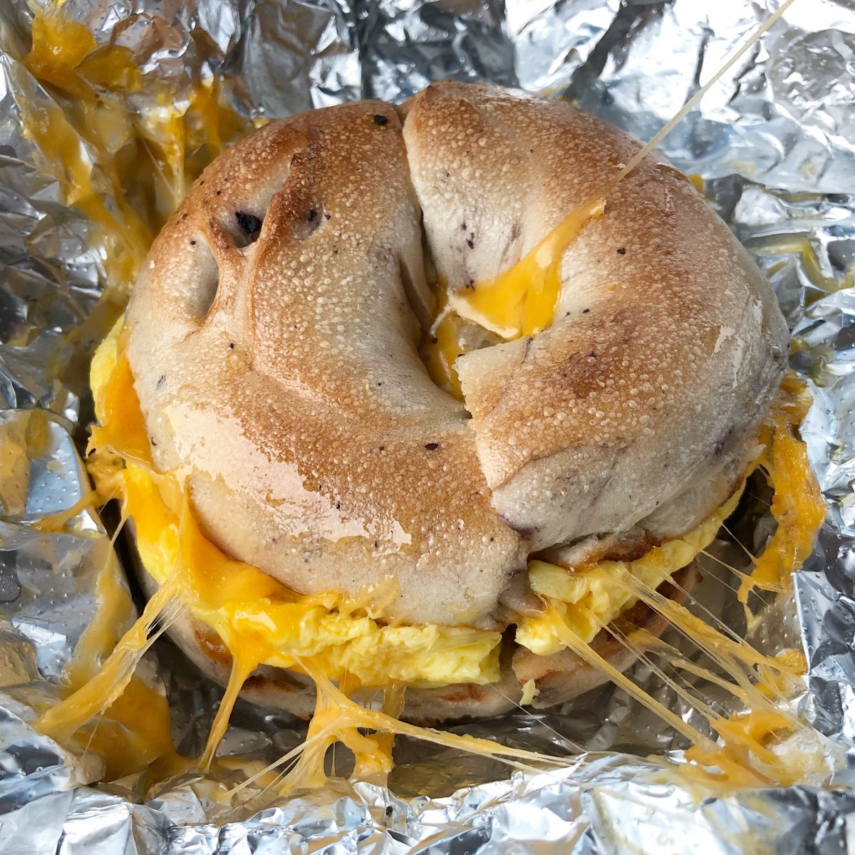 SmashingToledo's tweet photo. Oh baby #Eggel @barrybagels Blueberry bagel with egg, sausage & cheddar. #maumee https://t.co/vAyJ5F5ToF