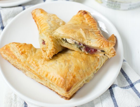 Stock up on Spinach Artichoke &amp; Parmesan Dip this week so you can enjoy these Turkey Cranberry Spinach and Artichoke Turnovers with your leftover holiday turkey! 🍗 Follow our recipe ➡️ bit.ly/2zEYsDr