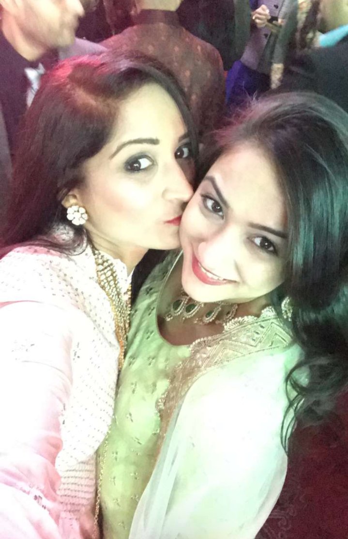 Neha with her sister at a wedding