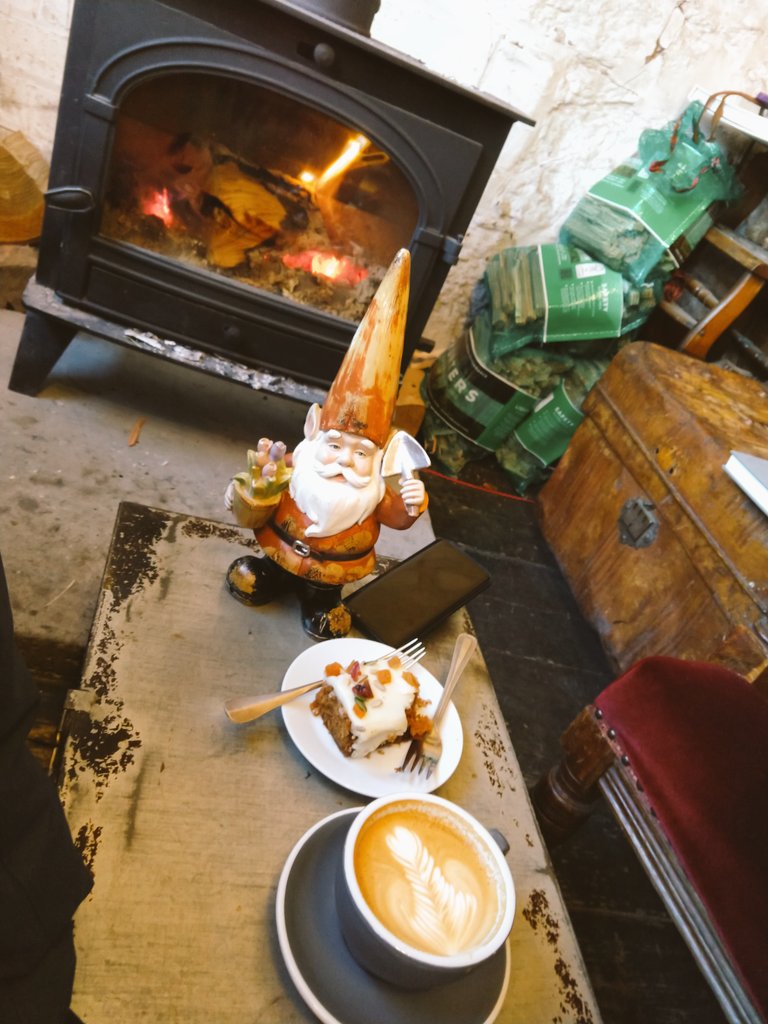 In recovery from dipping my boots in the chilly North Sea with a steaming mug in front of a cozy fire at @SteampunkCoffee in North Berwick #Scotland @VisNorthBerwick
