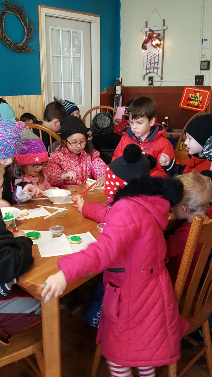 HeuveltonCSD's tweet photo. HIS kindergarteners went caroling through Heuvelton. We stopped at 6 businesses and sang songs. Pictured we are at the State St Deli where students were given sugar cookies to decorate and eat. https://t.co/C5UrICbb38