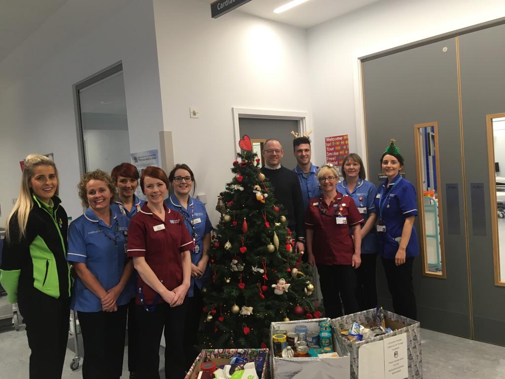 WesternHSCTrust's tweet photo. Our staff in Urgent Care and Treatment Centre and the Cardiac Care Unit in the Omagh Hospital presented boxes of food to pastor Tim Shiels, Omagh Community Church and Coleen Heaney for the local food bank #WT12DaysOfChristmas https://t.co/A7klReiwqC