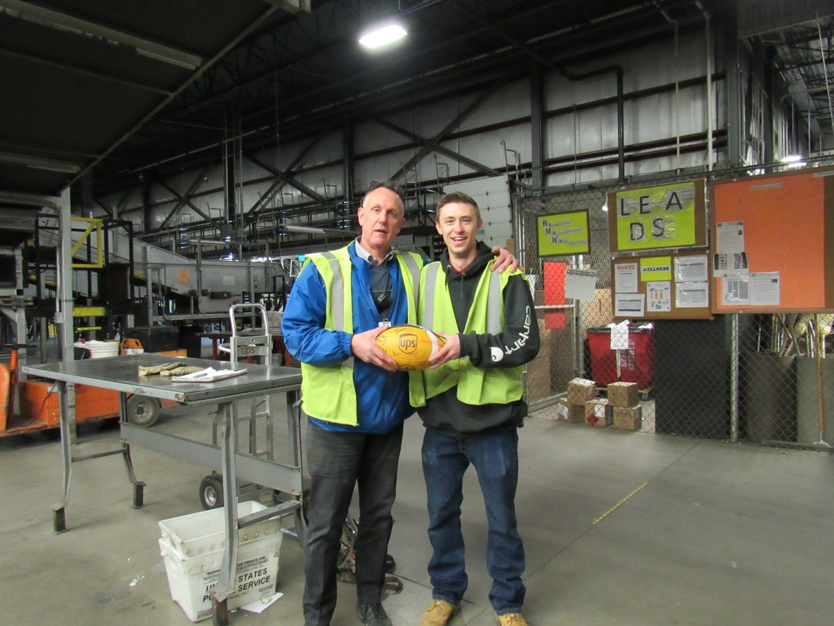 UPSEnglewood's tweet photo. TOUCHDOWN ENGLEWOOD!!! PT Supervisor Cole hands the #GridironSafetyRelay ball to Sort Manager Mike Romano as the Preload goes INJURY FREE and for all of Peak 2018!! GREAT JOB!! #DontFumbleSafetyDM #CaughtSafely #PreloadProud @WadeLeier5 @MPZakely @SchmitSeth @DesertMTUPSers @up https://t.co/NdyG4XvT6P