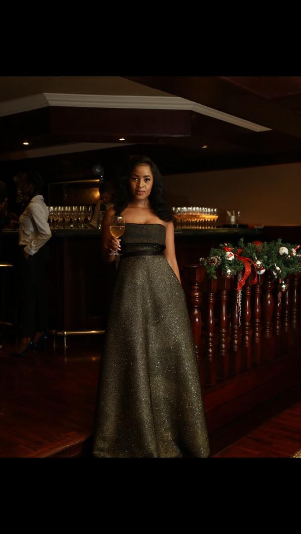 OfficialFaddic's tweet photo. @Tumie_Nthutang sparkling in a @faddicofficial black and gold dress for the #JWcodeblackbots https://t.co/4NFiiFi6h7