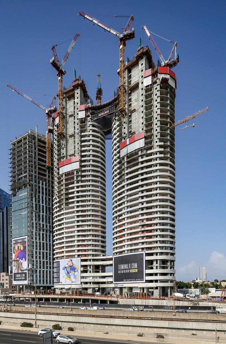 PERIgroup's tweet photo. A great #PERIproject in Israel: Two rounded #residentialbuildings in the heart of Tel Aviv city. The construction consists of a #concrete core with columns and several security rooms. Our engineers tailored the #formwork and stage solutions exactly to the project requirements ✅ https://t.co/grH7FBVNgf