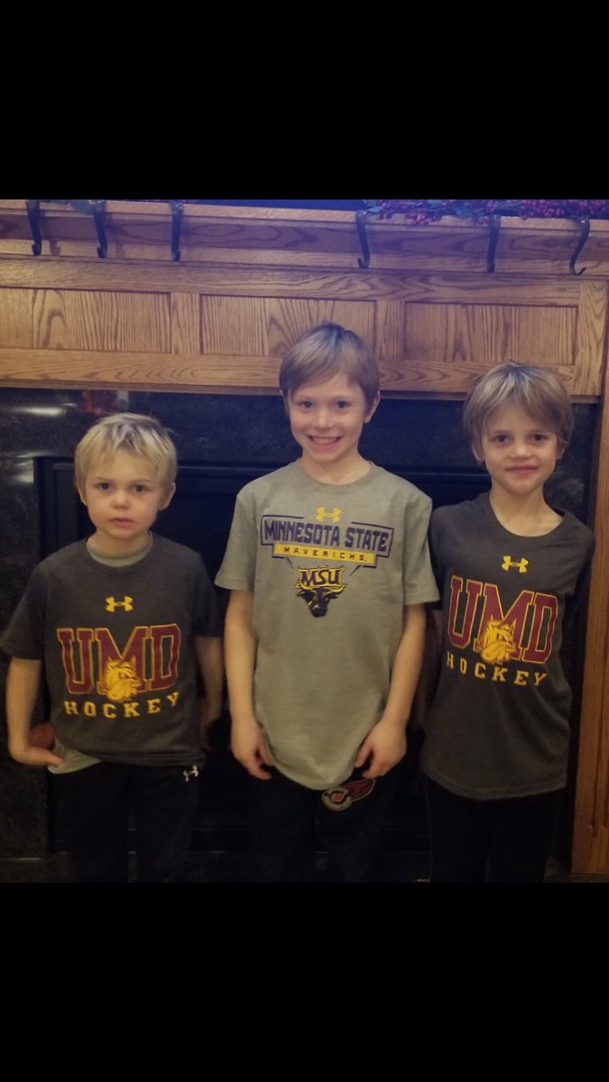 Cousins exchanging shirts of their favorite hockey teams!!