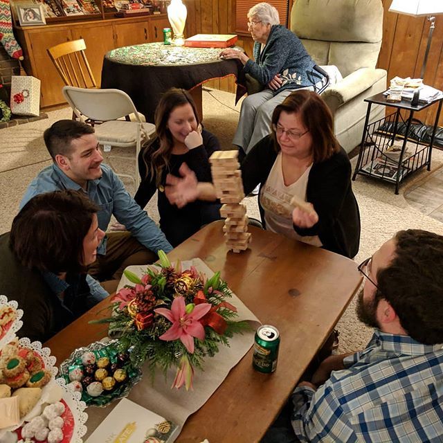 bennreading's tweet photo. Jenga! .
.
.
A blending of families this Christmas! I love this shot I got of @haleyk_smith , @schmittaytim , @saredeee , @becky.ecky , and @geoff_benn all playing together (Grandma and I were working on a puzzle in the background, and @salsagevil is cle… https://t.co/TKu1WjOIM2 https://t.co/IMsTc2zYF0