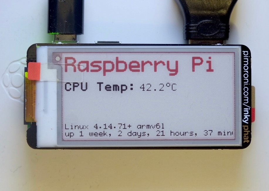 Raspberry Pi Zero W with Inky pHAT ePaper display showing CPU temperature, uptime, and uname info.