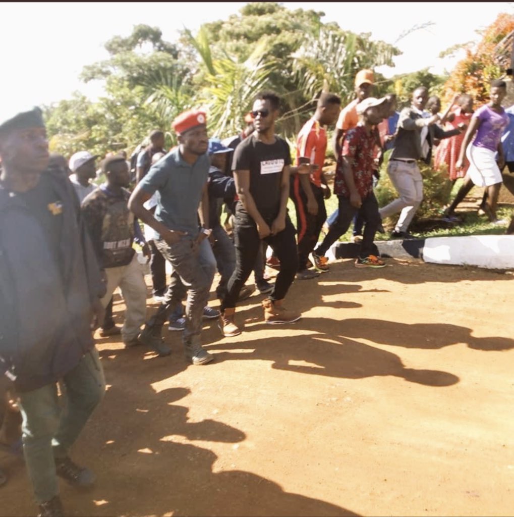IsabellaTugume's tweet photo. And the standoff begins, Ugandans dispersed by police using tear gas. they come to stand with @HEBobiwine. He insists the show will go on while Police spokesperson says he hasn’t gotten clearance. 
Parliament described this blocking as unconstitutional

Pics 📷@SoftPowerNews https://t.co/oZJFNOmKG5