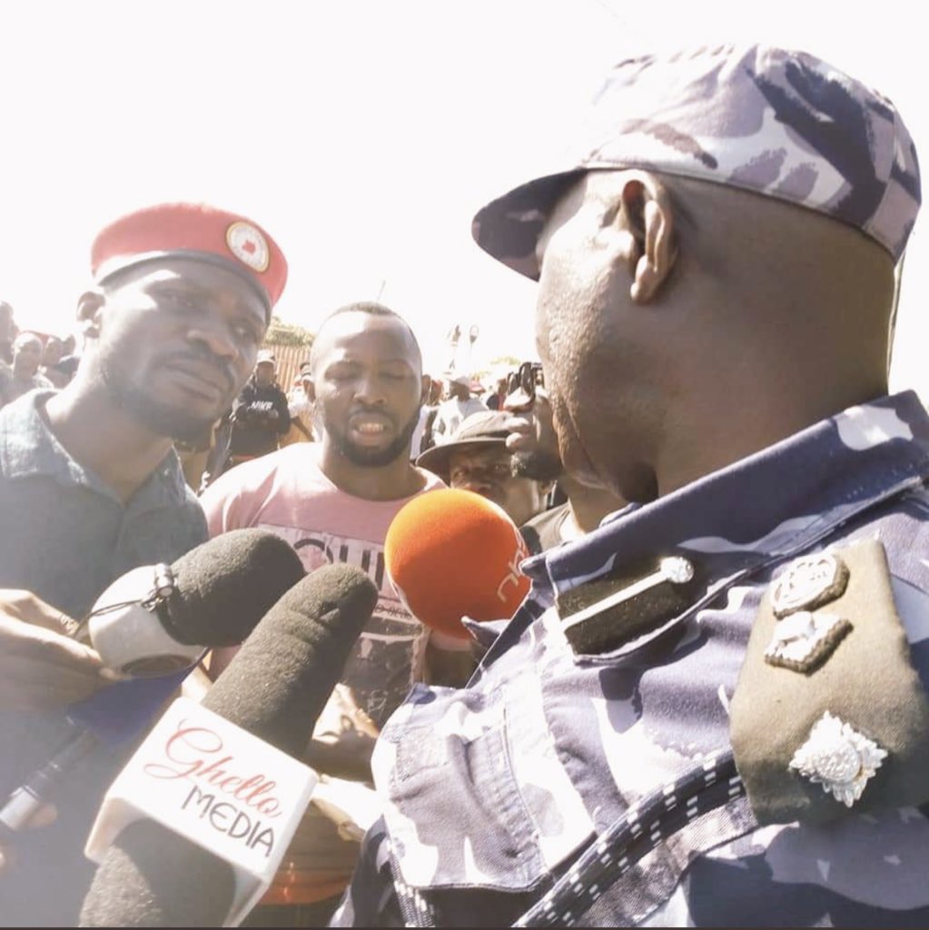 IsabellaTugume's tweet photo. And the standoff begins, Ugandans dispersed by police using tear gas. they come to stand with @HEBobiwine. He insists the show will go on while Police spokesperson says he hasn’t gotten clearance. 
Parliament described this blocking as unconstitutional

Pics 📷@SoftPowerNews https://t.co/oZJFNOmKG5