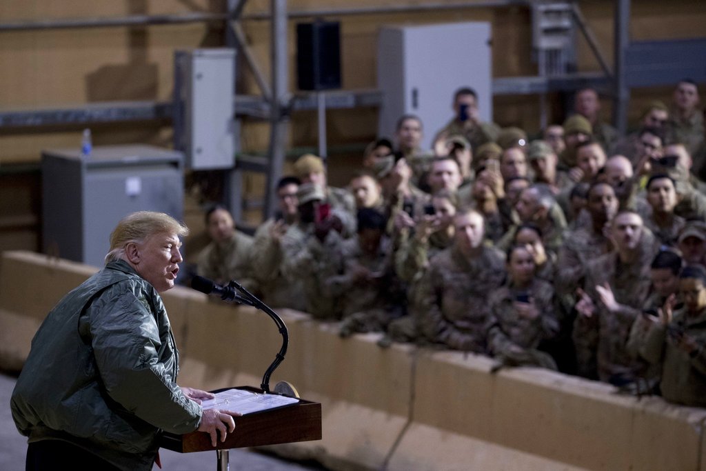 Trump and Melania visit troops in Iraq, President defends his decision to withdraw from Syria