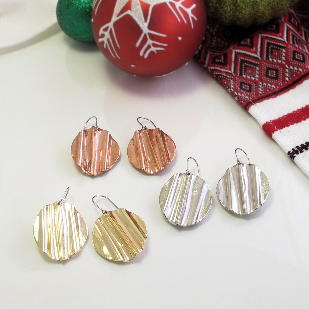 Go bold for New Year's Eve with these fun statement earrings. #ootn #ootd #outfitofthenight #ootninspo #dolledup #handmadefashionaccessories #roundearrings #largeearrings #diskearrings #rusticstyle #rusticjewelry #rusticjewellery #bohochicearrings #bohochic #bohoearrings