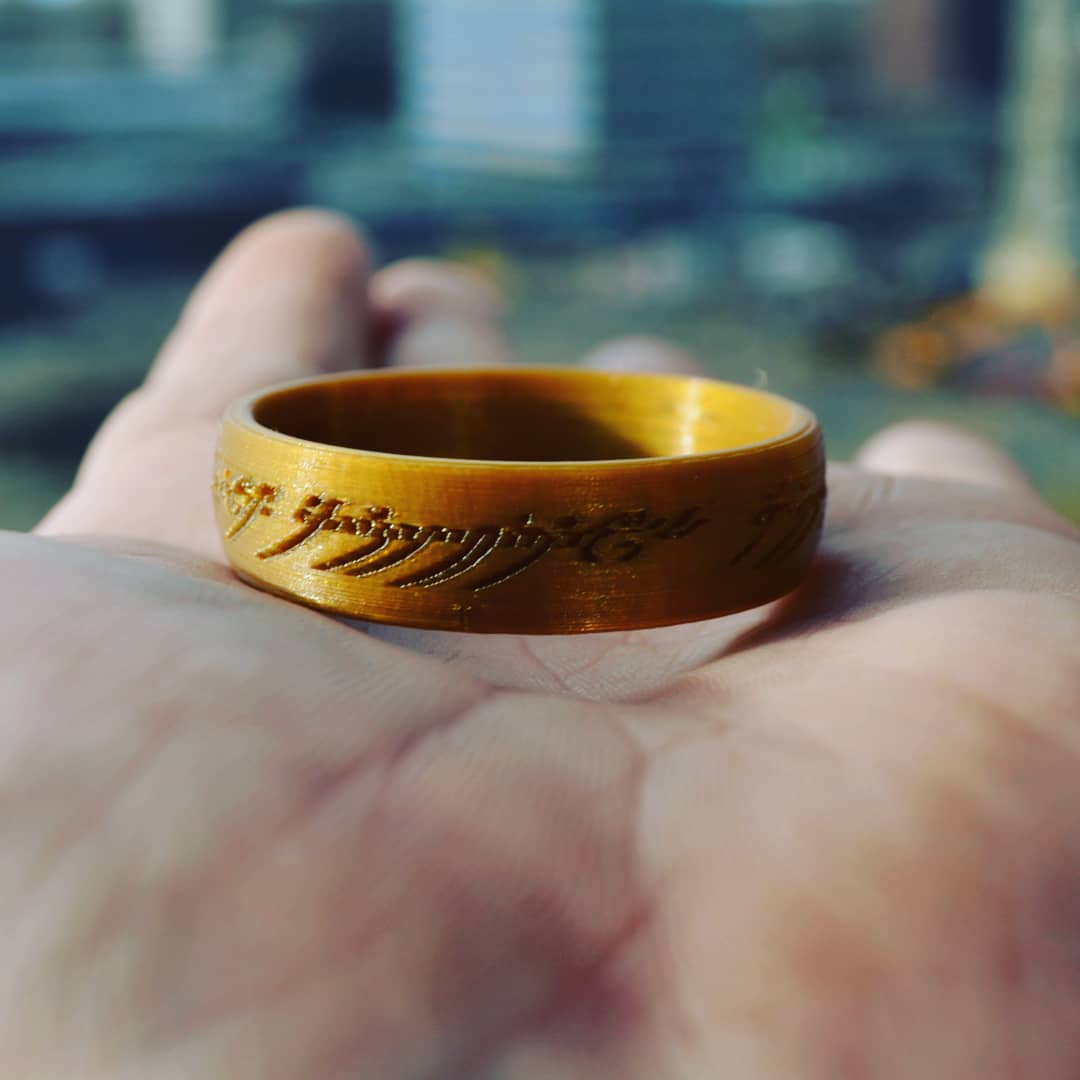 de3dprintman's tweet photo. Printed The One Ring (@thingiverse thing:2434291) in gold @RealFilament pla with my 0,15mm #Slic3r profile on the #YAN3DPrinter by @FurlingTech and it came out really beautiful. #3Dprinting #LOTR #TheOneRing https://t.co/aZUd3vHRTU