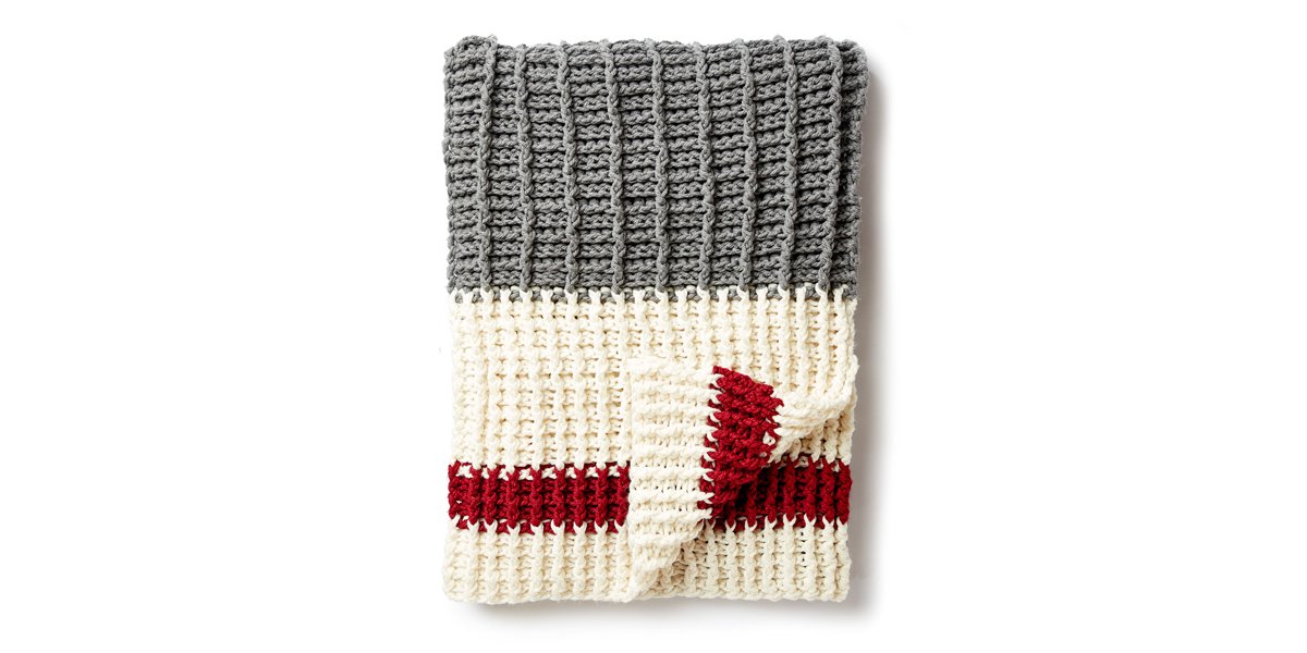 Yarnspirations1's tweet photo. This crochet throw, inspired by the classic sock design, made it to our top 10 home décor patterns of 2018 list! Find the easy pattern here: https://t.co/utgjeXGY0C #Yarnspirations #BernatSofteeChunky https://t.co/SOkJGbUfxY