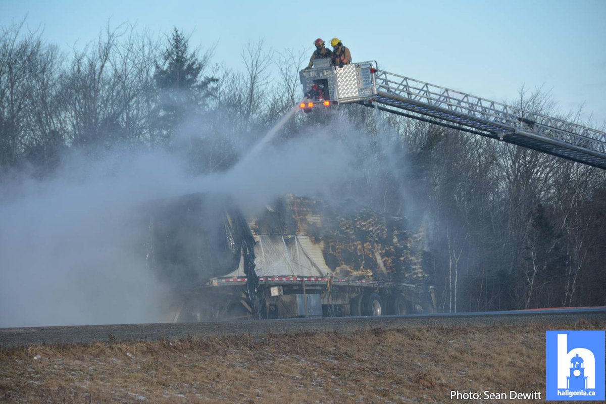 hfxtraffic's tweet photo. Hwy 102 is completely blocked inbound approaching the airport as crews tackle a trailer fire. https://t.co/8WYYRglxu4