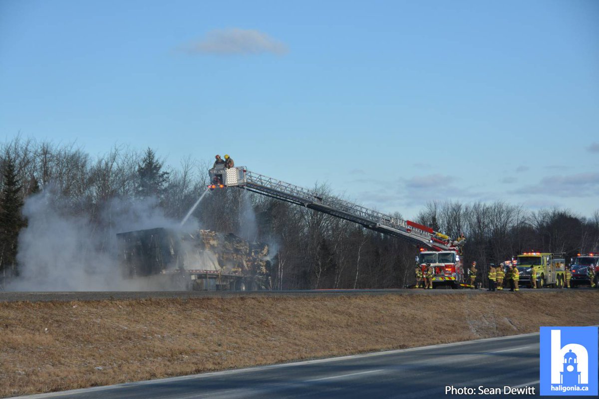 hfxtraffic's tweet photo. Hwy 102 is completely blocked inbound approaching the airport as crews tackle a trailer fire. https://t.co/8WYYRglxu4