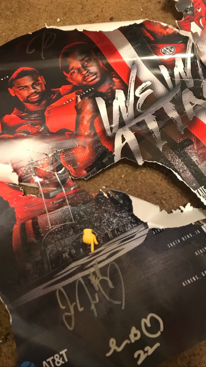 5k_chick's tweet photo. We Will Attack or should I say little asshole Kirby kitty attacked my autographed 2017 poster I was planning to frame! (thatโs what I get for procrastinating) Luckily my @FrommJake autograph is still intact๐! #GoDawgs #fanday2017 #loveAthens @piejones21 https://t.co/JIUF22AV9w