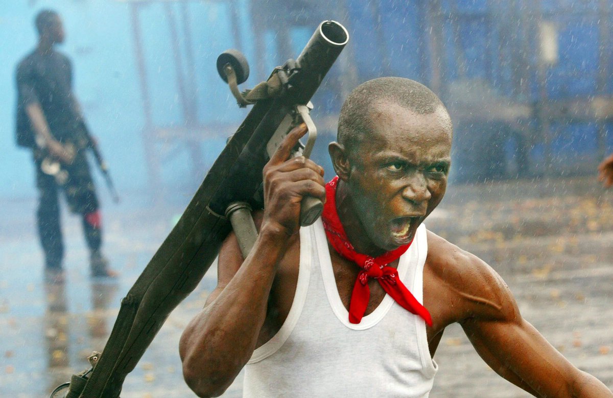 #BestOf2018 on the @Visapourlimage feed: A #soldier loyal to the government shouting a battle cry after firing a rocket-propelled #grenade at #rebel forces at a key frontline bridge. #Monrovia, #Liberia, July 23, 2003. Photo by #ChrisHondros/ @GettyImages