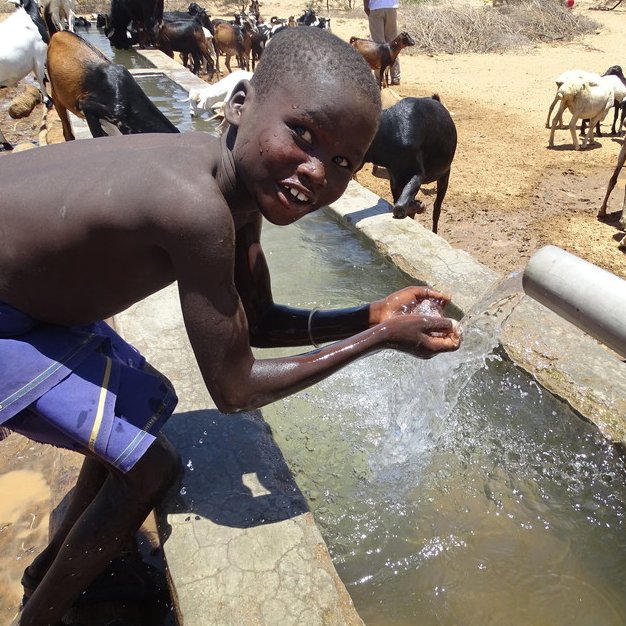 Eyanai, 7, drinks from a water point in Turkana County, Kenya, where ChildFund installed a new borehole and solar-powered pump. Now more than 150 households have access to clean, safe water. “Before, we used to walk very far, looking for water," he says. "Now we have enough."