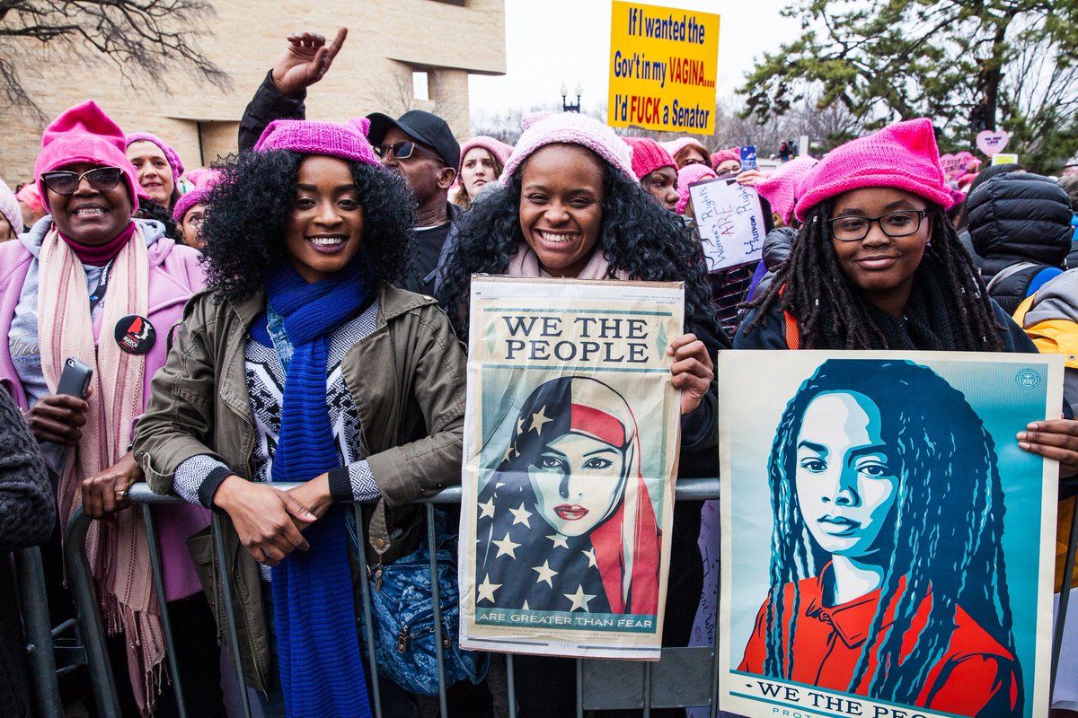 Photo of women holding signs