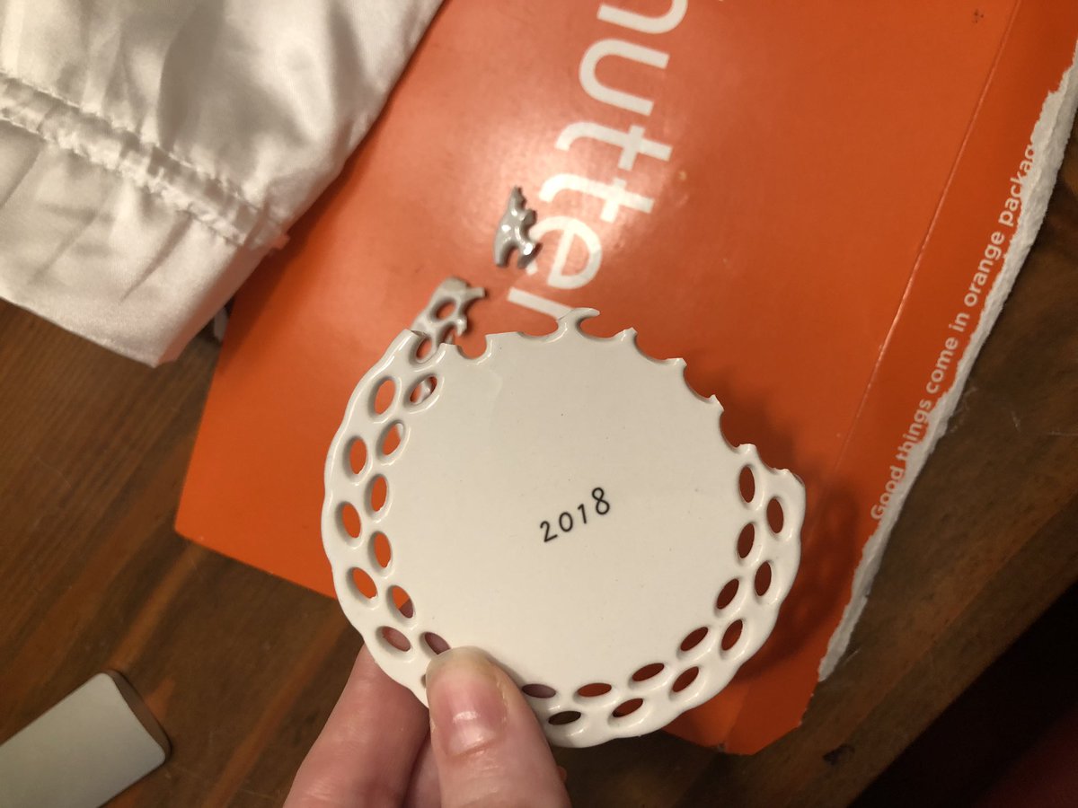 memphispenelope's tweet photo. @Shutterfly I’m so disappointed! I just received this ceramic ornament and it was completely broken. It wasn’t packaged in any sort of protective wrap, only a paper envelope and thin silk bag. Please help me get this fixed! https://t.co/5yLUz7R1h5
