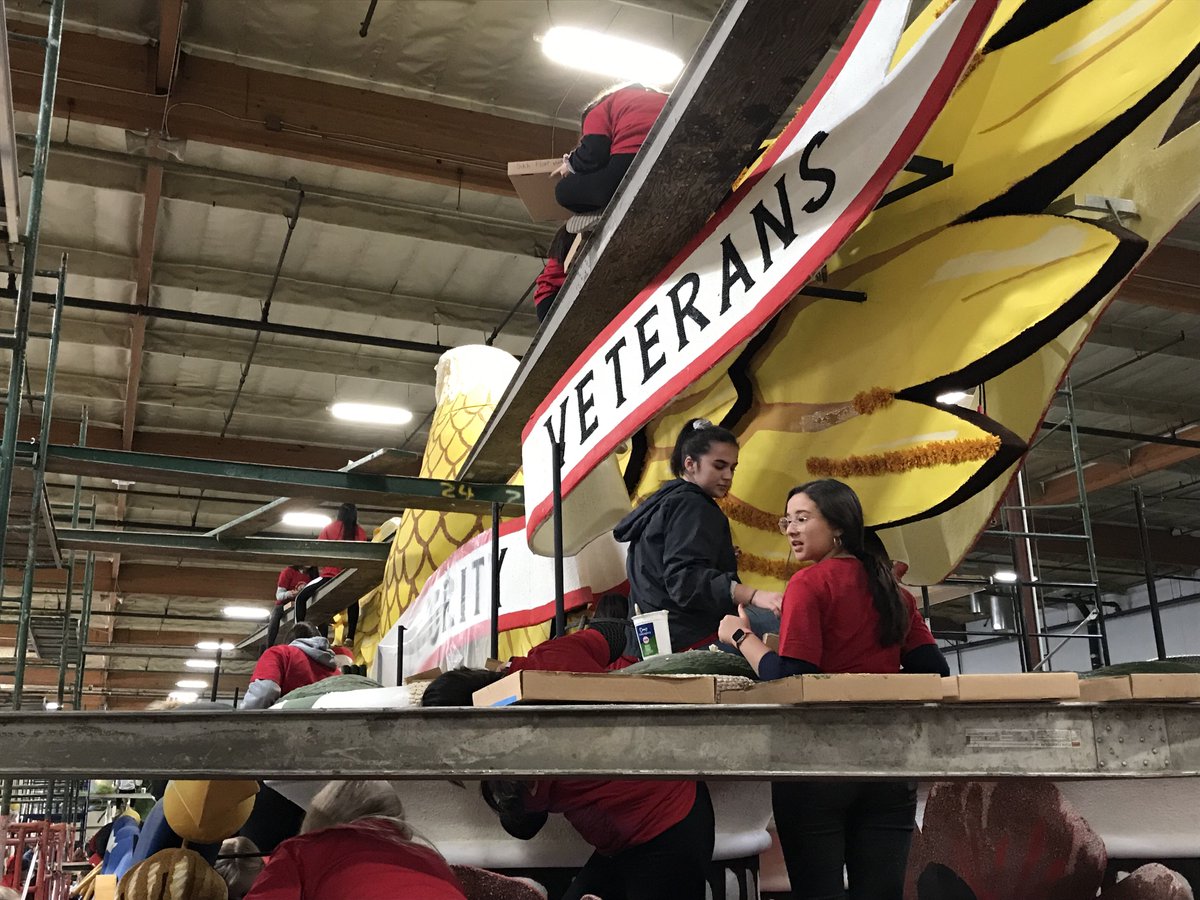 AmericanLegion's tweet photo. The American Legion centennial float was decorated today by members of The American #LegionFamily. The float will be the third in the @RoseParade lineup on Jan. 1. More info: https://t.co/bidpgRS5Xm. #RoseParade https://t.co/5ppKG2HP3X