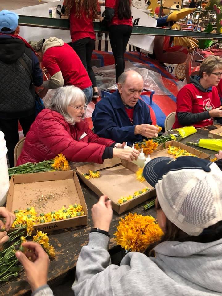 AmericanLegion's tweet photo. The American Legion centennial float was decorated today by members of The American #LegionFamily. The float will be the third in the @RoseParade lineup on Jan. 1. More info: https://t.co/bidpgRS5Xm. #RoseParade https://t.co/5ppKG2HP3X