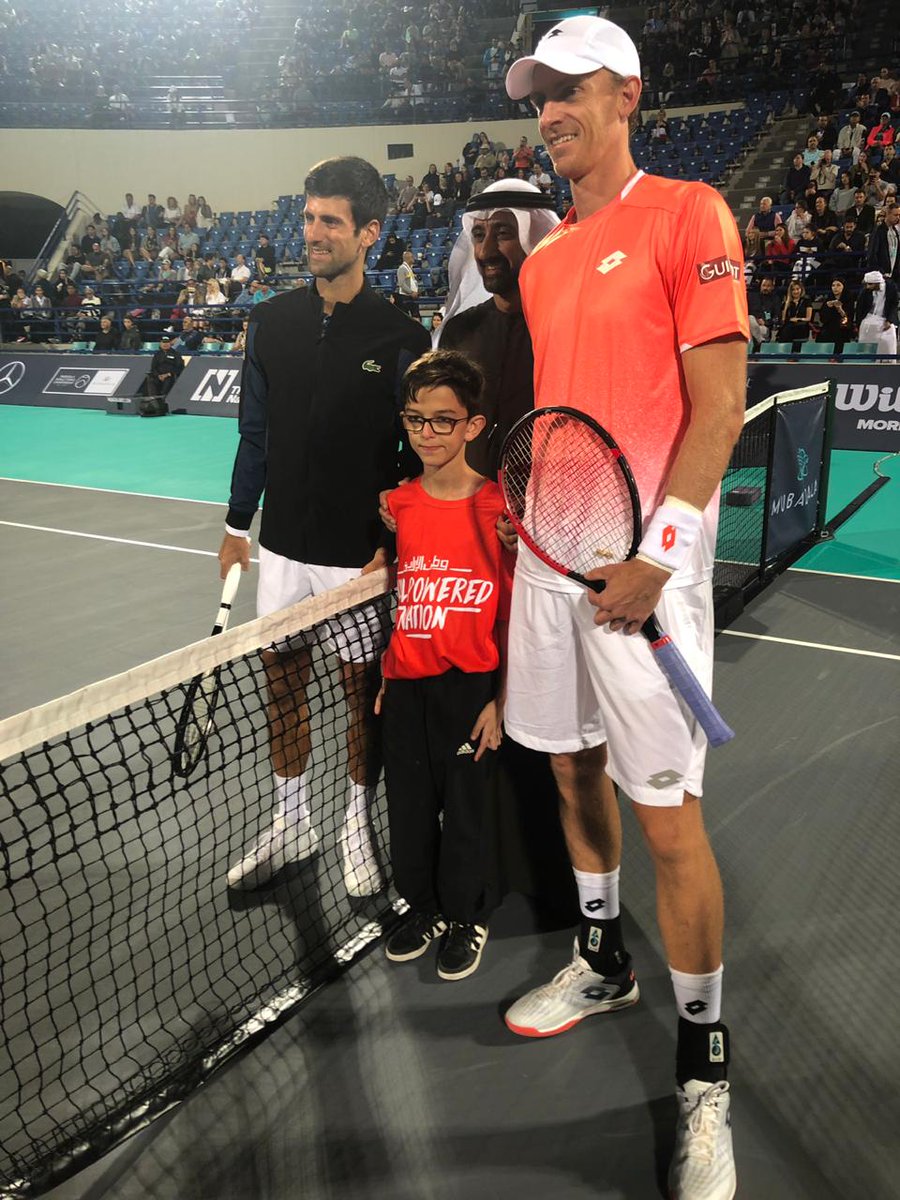 Mubadala's tweet photo. Our Deputy Group CEO and Chief Corporate &amp; Human Capital Officer, Homaid Al Shimmari on court for the official coin toss with the @WorldGamesAD athletes ahead of the @MubadalaTennis final between @DjokerNole and @KAndersonATP.

@SpecialOlympics https://t.co/cp7QbcBjec