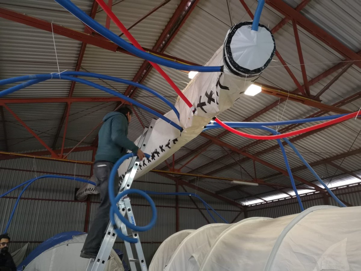 aid_brigade's tweet photo. Yesterday we built a system to heat up 15 tents in a wearhouse in Ušivak camp. The idea was to get the heat from the big sleeve of the main heaters into the tents with a series of pipes so that's what we did! It was a hard working day but it was worth it! https://t.co/dwZrJ4jqJo
