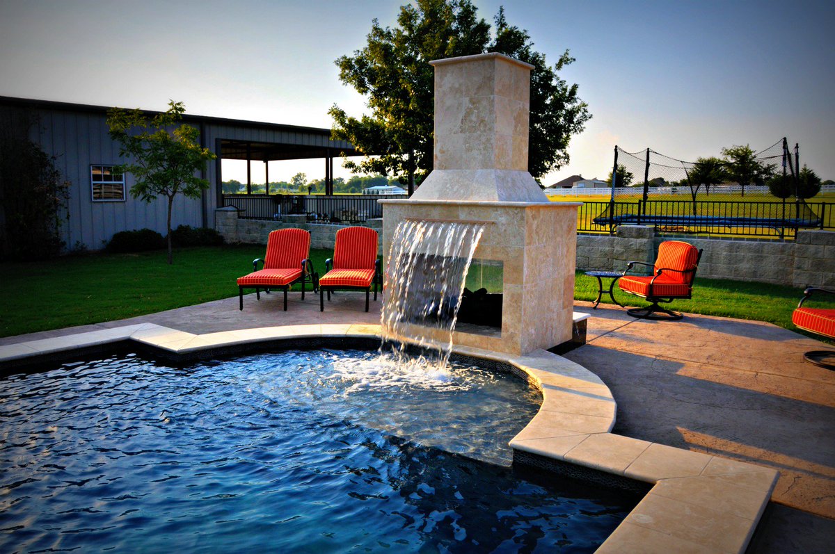 Fireplace by the pool? No problem! We make your ideas possible here at Puryear Custom Pools! Call us today to get started 817-306-5169! Our team of designers are ready to help you create the pool of your dreams! #PuryearCustomPools #FortWorthTX #CustomPools #Ingroundswimmingpool