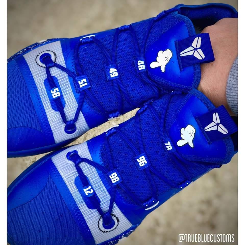 NotJerryTipton's tweet photo. Ashton Hagans’s shoes are the greatest shoes in the history of footwear. 

Every UK championship is referenced by year, and he also has L’s down with Mickey Mouse hands. 

Perfection. https://t.co/Yiu578Kb0i
