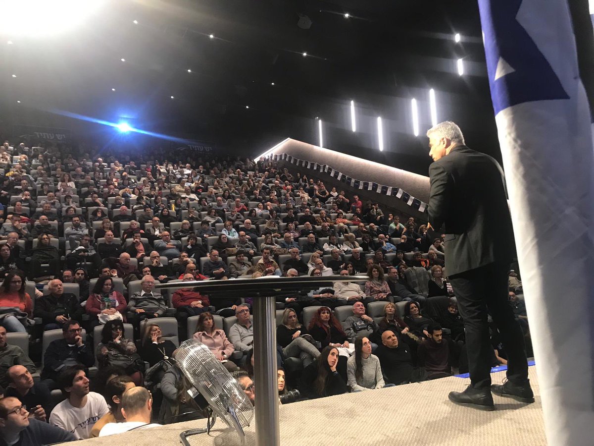 YeshAtidEnglish's tweet photo. First @yairlapid town hall meeting of the campaign and it’s absolutely packed. People standing in the aisles and sitting on the floor. When we say we’re the strongest party in the field, this is what we mean. #YeshAtid https://t.co/JJ9WOmLBna