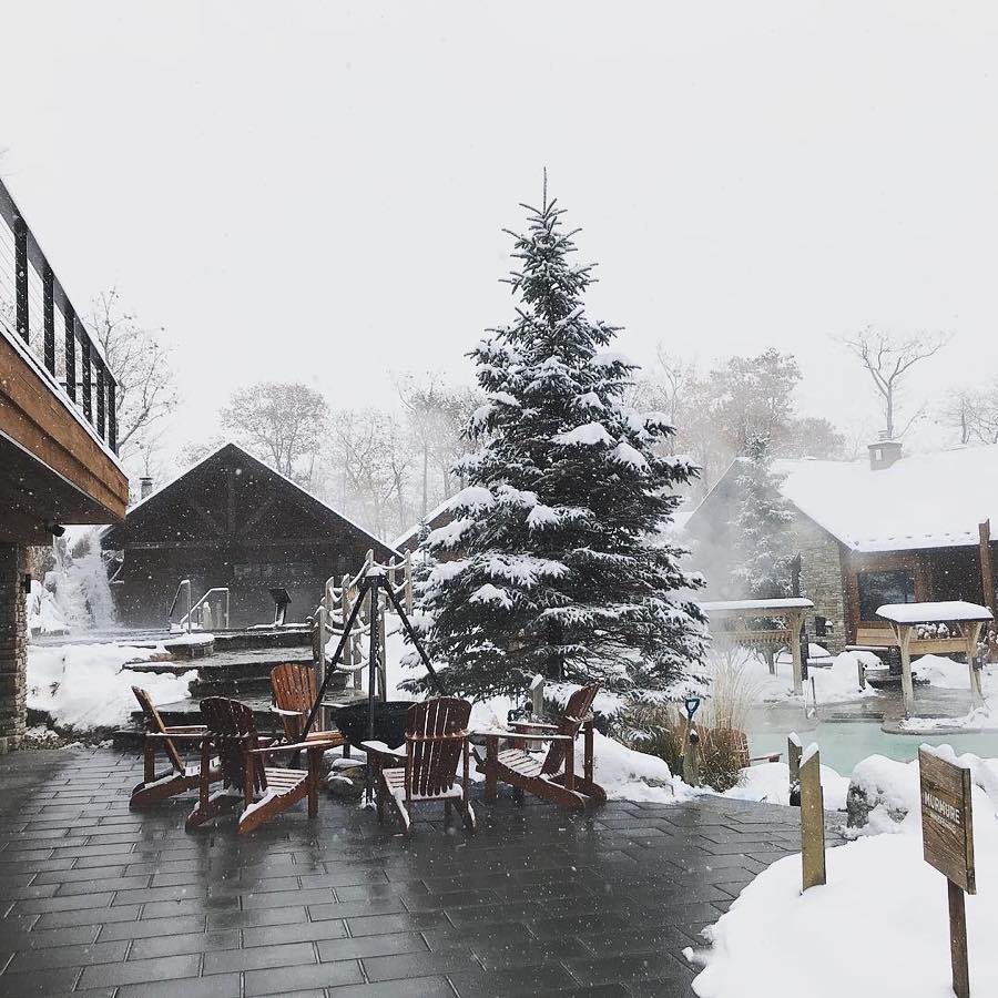 Canada's tweet photo. There’s nothing like a cold winter’s day to get you outside in your swimsuit. #LeNordik Spa-Nature in Chelsea, Quebec is the place to be for some holiday rest &amp; relaxation. Sit back in the bubbles, sip some bubbly and send off 2018 in style. 🍾#SundayFunday 📷sweatspott/IG https://t.co/xEGjjPYWFP
