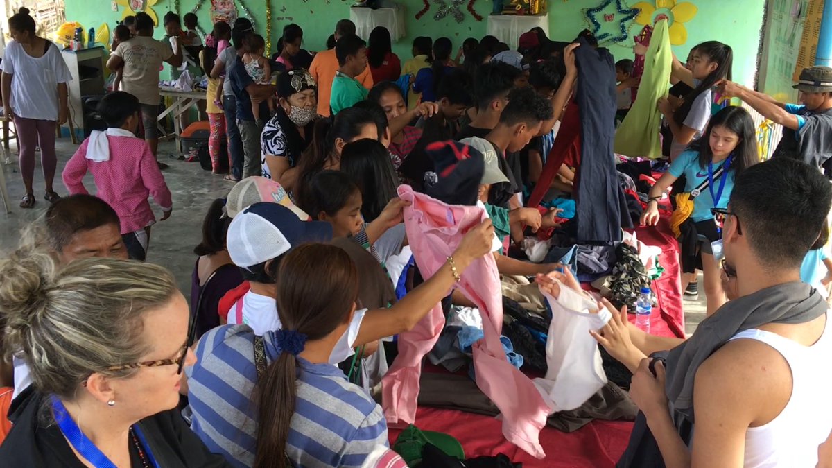 MikeCLeadership's tweet photo. While in Tarlac, Philippines, our @TCDSB student leaders set up a free Christmas market with their donations for the people in the village. #PH2018 #CatholicStudentLeadership #FaithInAction https://t.co/XahDFskMpg