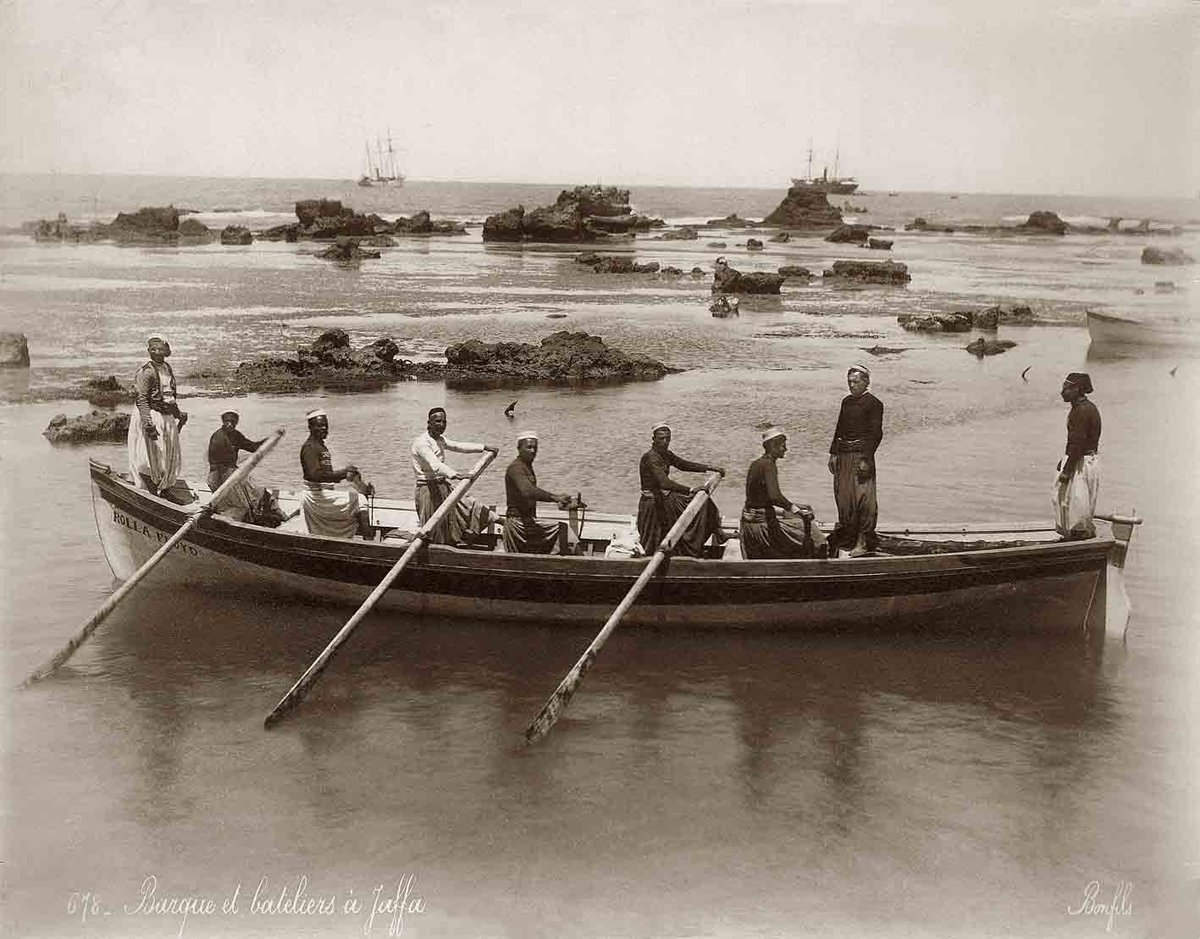 PhilippeBostrom's tweet photo. A boat rocks outside the harbor of #Jaffa in the late 19th century. The #Greek name #Ioppa is said to derive from #Cassiopeia, mother of #Andromeda. https://t.co/K8LIIqCQXy