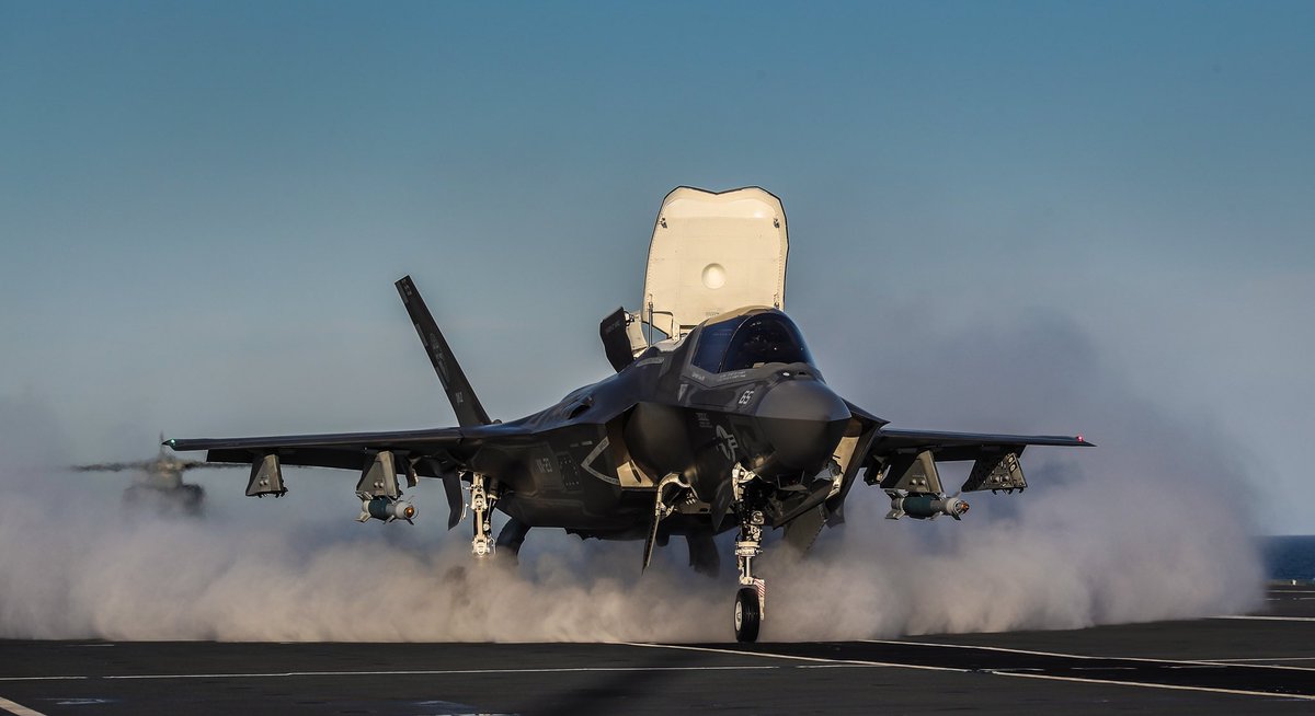 F35 throws up vapour from the deck as it accelerates to the ramp.