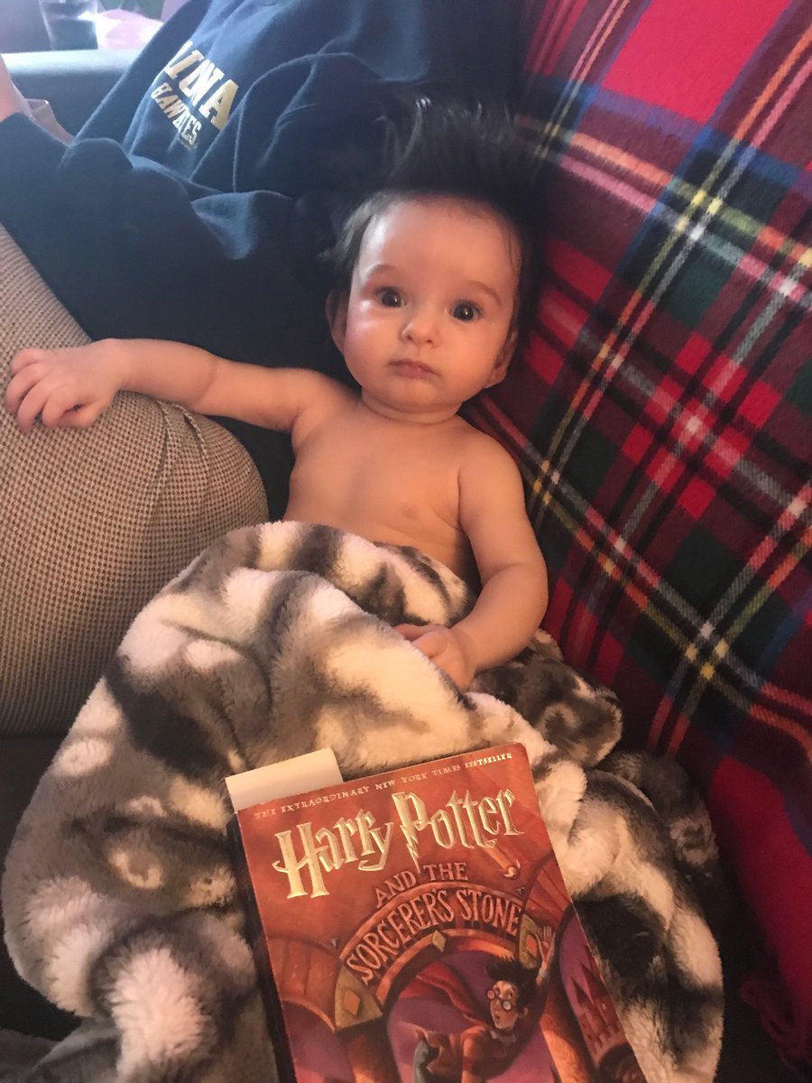 My 4 month old sits nicely for some Harry Potter reading time :,)