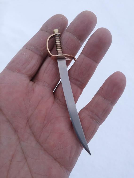 RavenStagKnives's tweet photo. **NEW** Titanium dabber mini sword is now available ***FREE SHIPPING IN THE USA*** https://t.co/M9TpZoIzsu #dabber #minisword #dabs #sword #dailydabbers #cbd https://t.co/UVPCEEDms6