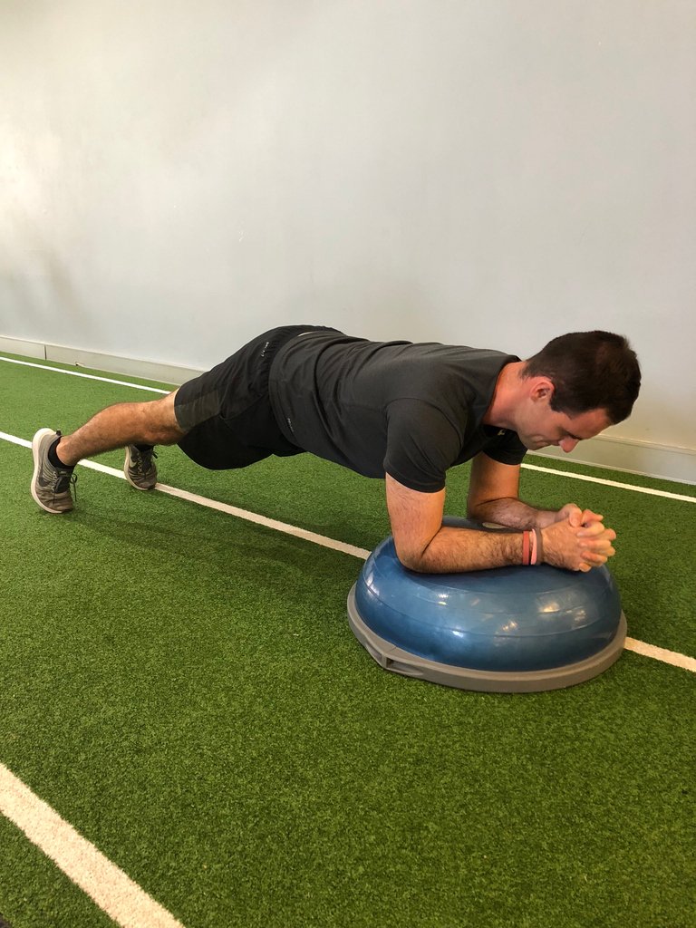 ProHealthExerc1's tweet image. Plank with Bosu Ball 
A great way to progress an exercise is to add an element of instability. This makes the smaller stabilising muscles work alot harder to maintain correct posture. Adding a bosu ball under your forearms in a plank will increase the difficulty!