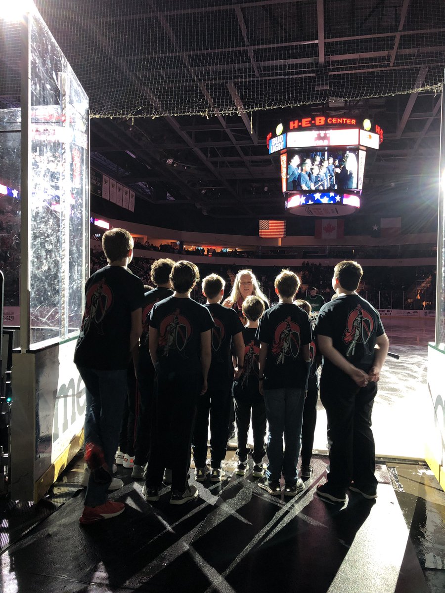 APMcWherterLTMS's tweet photo. Varsity Boys Choir and Mrs. Gunter representing LTMS at the Stars hockey game. #nationalanthem #itswhoweare @ltmschoir @LakeTravisMS https://t.co/WWF0KS6A2i