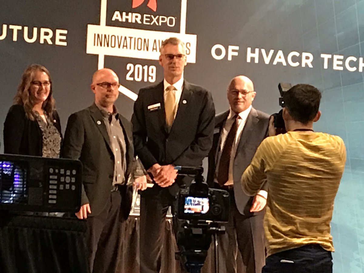AutomatedLogic's tweet photo. Our president, Mead Rusert and product manager, Steve Appling accepted the 2019 Innovation Award in the building automation category for our #OptiFlex virtual integrator! #AHRExpo https://t.co/bhBCQxTKDb