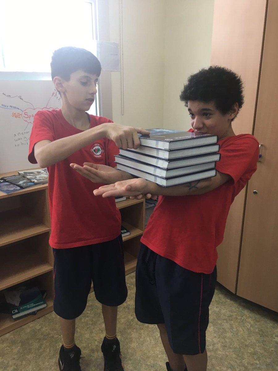 MsYasminsLab's tweet photo. The tipping point! Grade 7s learn all about being structures by trying to hold as many textbooks as they can...before the structure fails!! #OICSscience #science #structures https://t.co/A2Mhn3qO32