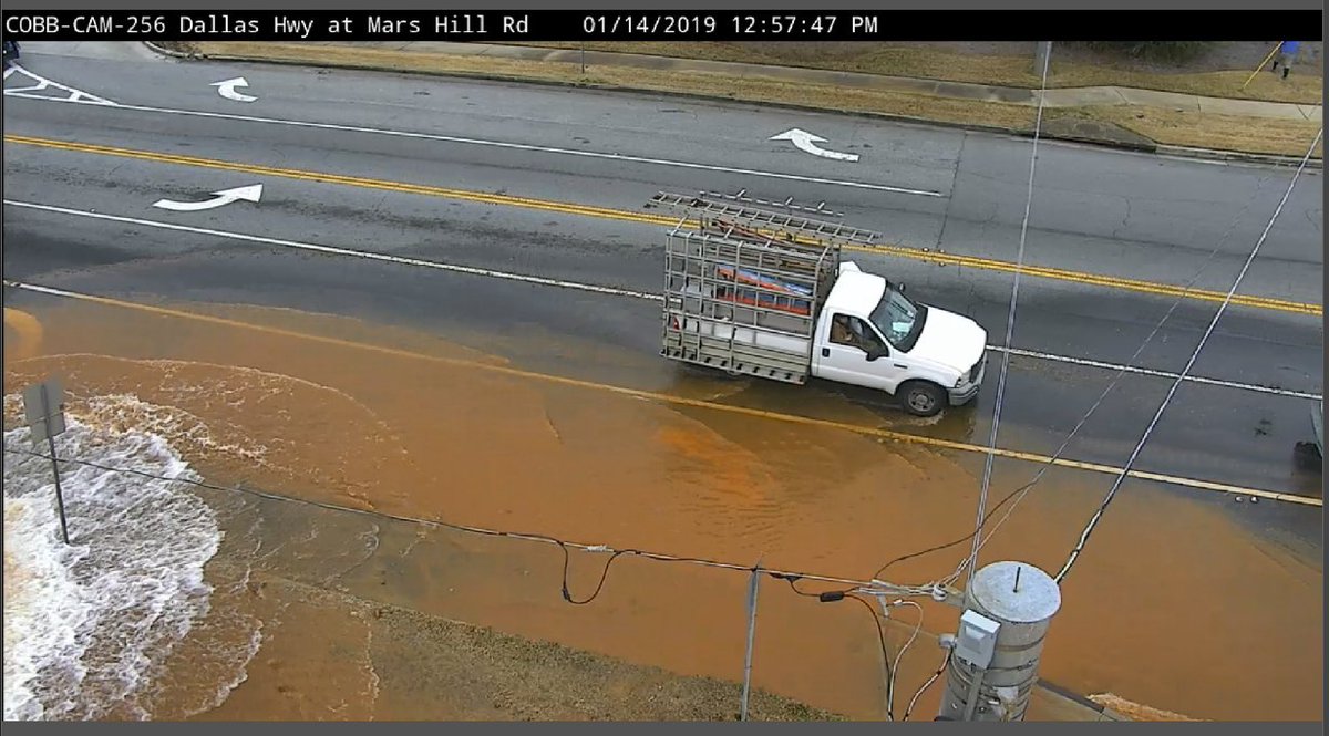 CobbDOT's tweet photo. ROADWAY FLOODING:  Dallas Hwy and Mars Hill Rd flooding due to water main break #ATLtraffic #AVOID https://t.co/gOOEeYGapy