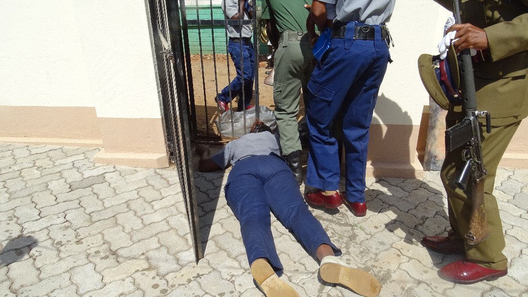 citezw's tweet photo. Pictures from earlier today. A cop fainted from teargas shot at the High Court . (Pic by Thuso Pamenus) @PoliceZimbabwe #shutdownZimbabwe #Asakhe https://t.co/D4aNHcbjTi