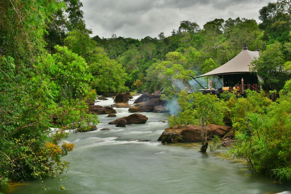 360PrivateTrvl's tweet photo. The stunning Shinta Mani Wild sits on a waterfall-dotted wild waterside, in Cambodia. When you stay, your help is needed to protect the national park from loggers and poachers but you are handsomely rewarded with #incredibleexperiences See https://t.co/wEALgHzcwD for more info. https://t.co/NHrfIJKfvh