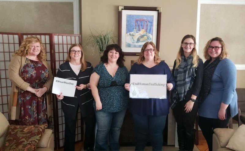 Staff from Friday wearing blue for #WearBlueDay on the National Day of Human Trafficking Awareness. Wear blue to join the fight against human trafficking and pledge solidarity with victims.