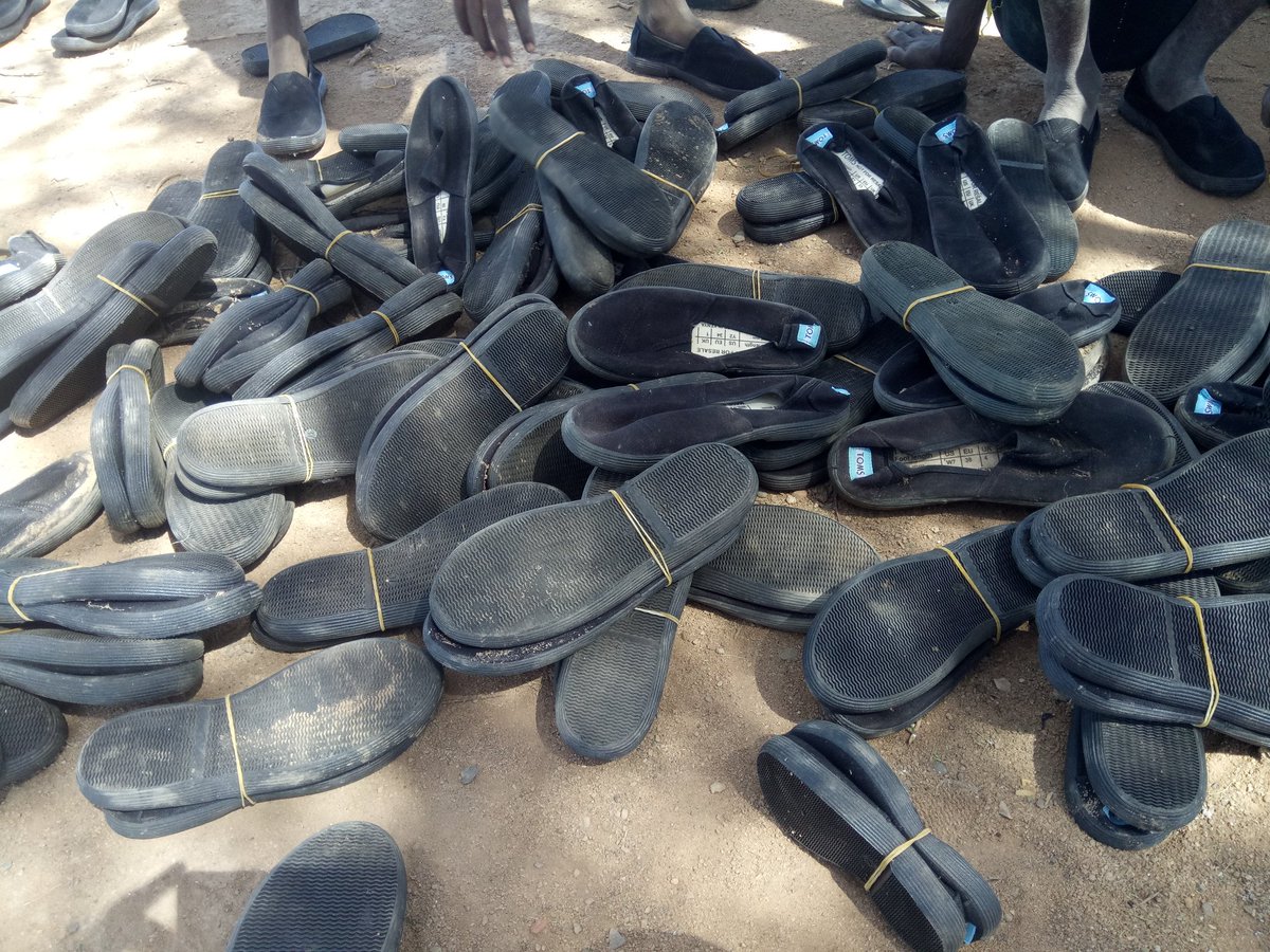 kootoroschool's tweet photo. Fitting in shoes donated by #AfyaTimiza Lokichar office!  Thank you @UNICEFKenya for school bags too!  @MumbiKaptere https://t.co/DHIkFg9BcQ