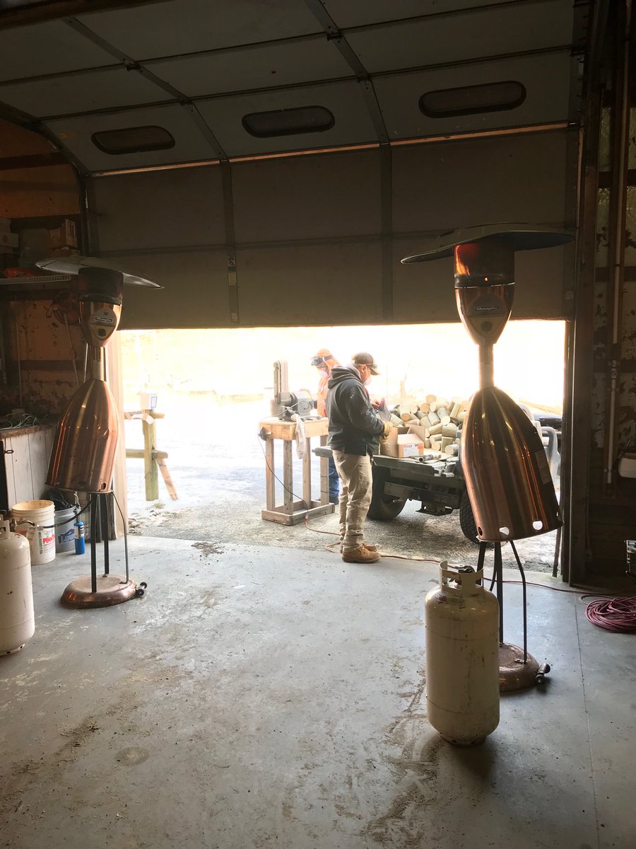 The staff is busy making our new set of tee markers. The heaters are keeping them warm and the dust stays outside