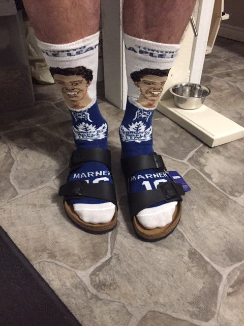 Rexhillier's tweet photo. @MapleLeafs Great time to break out my two favourite Christmas gifts! @Marner93 socks in Birkenstocks #LeafsForever https://t.co/0vSzqNTttQ